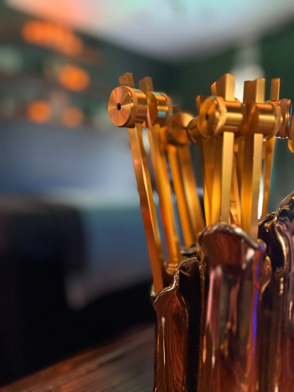 Weighted tuning forks in a glass holder in Ashley’s treatment room.